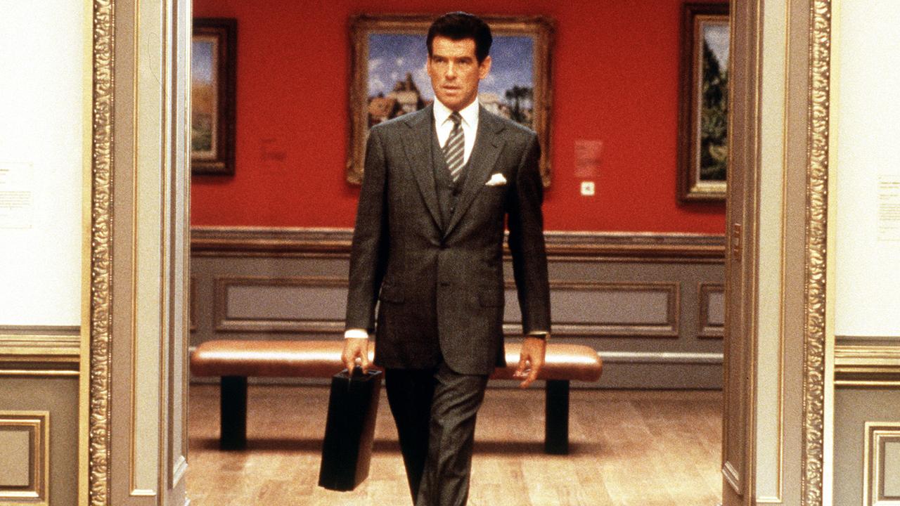 Pierce Brosnan as billionaire businessman Thomas Crown casually leaves the scene of the crime in The Thomas Crown Affair. the reality of art theft is quite different. Picture: AAP