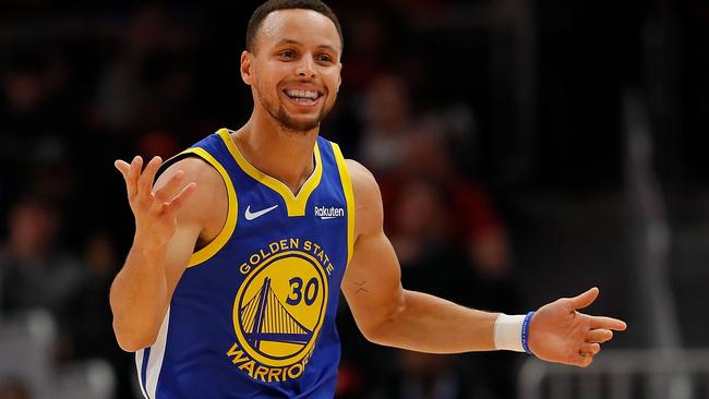 From Steph Curry to Tom Burgess … (Kevin C. Cox / Getty Images / AFP)