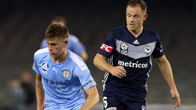 Connor Metcalfe (left) controls the ball during the round one A-League match between the Melbourne Victory and Melbourne City at Marvel Stadium.