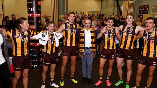 Australian Prime Minister Anthony Albanese sings the team song with Hawks players. Photo by Michael Willson/AFL Photos via Getty Images.