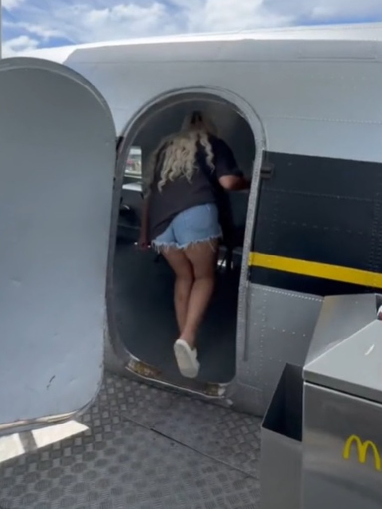 She climbed a set of stairs in the restaurant’s garden to get to the plane. Picture: TikTok/simplyyykatie