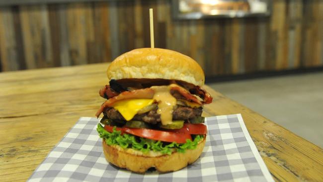 The El Burger namesake: beef patty, caramelised onion, American cheese, tomato, lettuce, pickles and El Sauce with added bacon ($11.90).