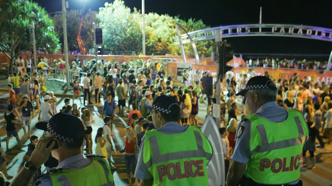 Police officers watch over the Schoolies week celebrations in Surfers Paradise.