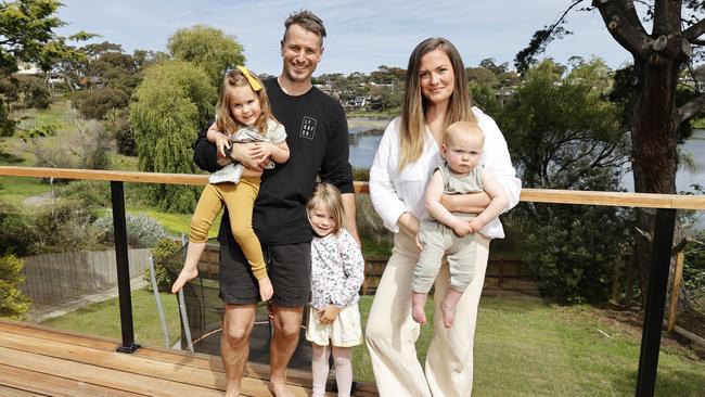 Jessica Robinson and her husband Vaughn with their kids Audrey, 4, Harriet, 3 and Llewyn, 10 months. The family is selling their renovated Ocean Grove home to make the most of the red-hot market. Picture: Alex Coppel