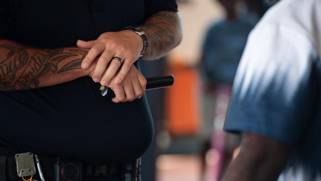 NT Police using wanding metal detectors. Picture: Pema Tamang Pakhrin.
