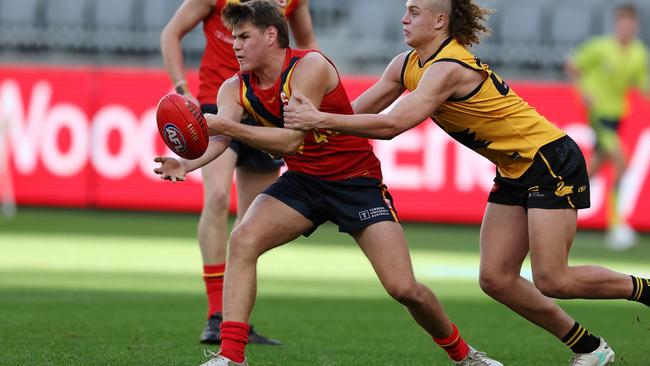 Alex Holt handballs under pressure for South Australia against Western Australia during this year’s AFL under-18 national championships. Picture: Will Russell/AFL Photos via Getty Images