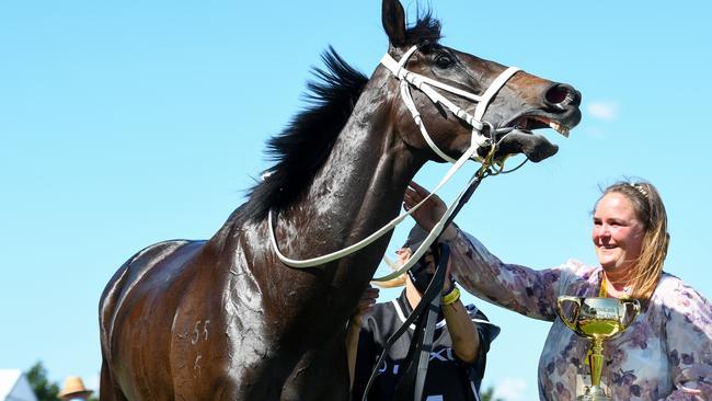 Assistant trainer Johanne Taylor with the Melbourne Cup trophy and the winner, Verry Elleegant, on Tuesday. Picture: Getty Images