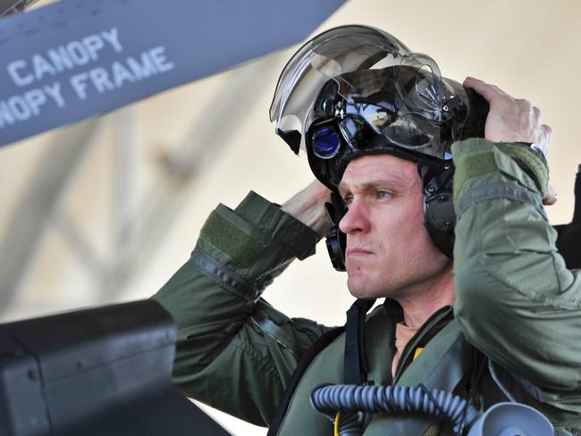 Royal Australian Air Force Squadron Leader Andrew Jackson, F-35 Lightning II student pilot, puts on his ‘virtual reality’ helmet before his first flight in an F-35A. Picture: US Air Force