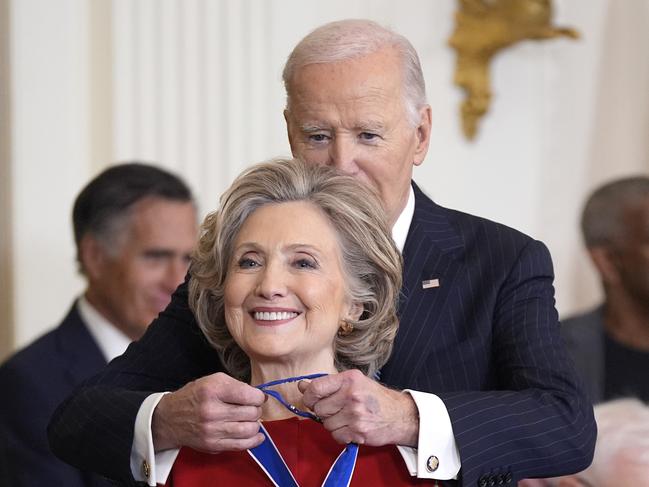 President Joe Biden, right, presents the Presidential Medal of Freedom, the Nation's highest civilian honor, to former Secretary of State Hillary Clinton, in the East Room of the White House, Saturday, Jan. 4, 2025, in Washington. (AP Photo/Manuel Balce Ceneta)