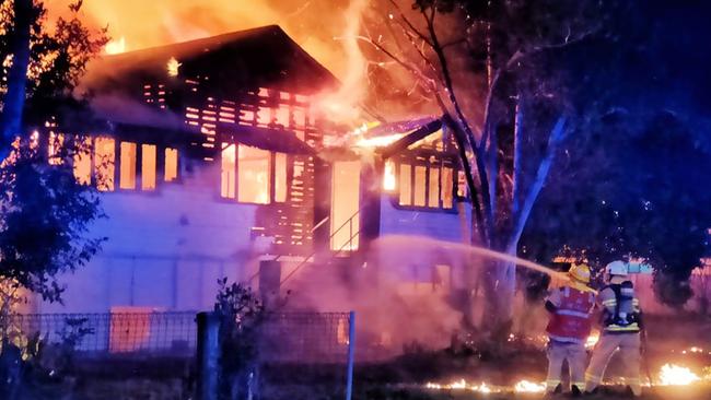 Firefighting crews battling to extinguish a house fire on Sheridan St in Cairns North. Picture: Peter Carruthers