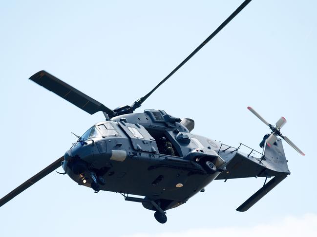 An airforce helicopter returns to Whakatane airport from White Island where a military team was dispatched to recover eight bodies. Picture: AFP