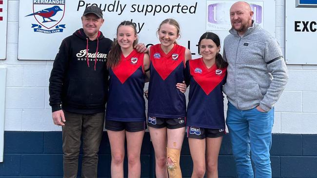 L-R: Robert O'Neill brother of Michael O'Neill , Banjo O'Neill, Polly O'Neill, Lucy O'Neill and David O’Neill brother of Michael O'Neill. The girls uncle was Michael O'Neill. Girls from the Southern Storm u/17.5 football team wore the old Kermandie jumper in honour of Michael O'Neill killed in Ukraine while assisting the Ukrainians against Russia. Picture: Cygnet Football Club FB page