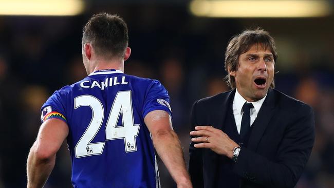 Antonio Conte (R), Manager of Chelsea congratulates Gary Cahill (L).