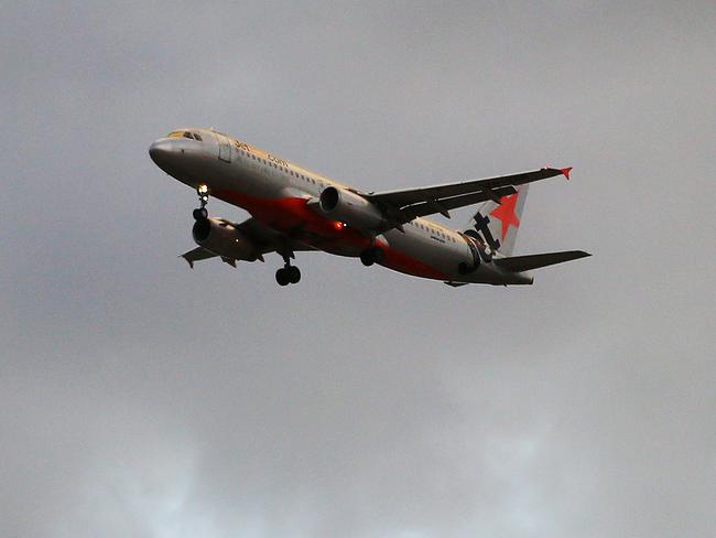 An Jetstar passenger jet flies through stormy skies. The Australian aviation industry has hit turbulence since the outbreak of the COVID-19 coronavirus, with passenger numbers falling dramatically with statewide lockdowns and border closures. But the dark clouds are clearing, with the federal government creating the Australian Airline Financial Relief Package, with $715 million of financial assistance for domestic airlines. Picture: Brendan Radke