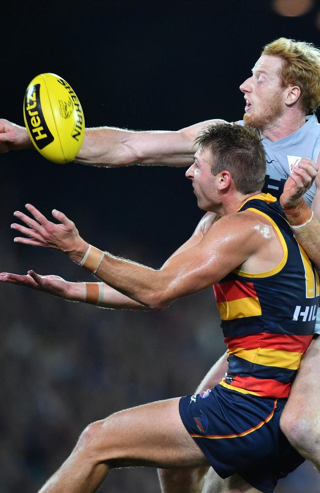 Daniel Talia tries to outmark Carlton tall Andrew Phillips on Saturday night. Picture: AAP Image/David Mariuz