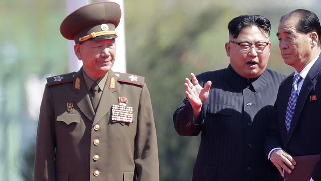 Hwang Pyong So, left, stands with Kim Jong Un, second from right, and North Korean Premier Pak Pong Ju. Picture: AP.