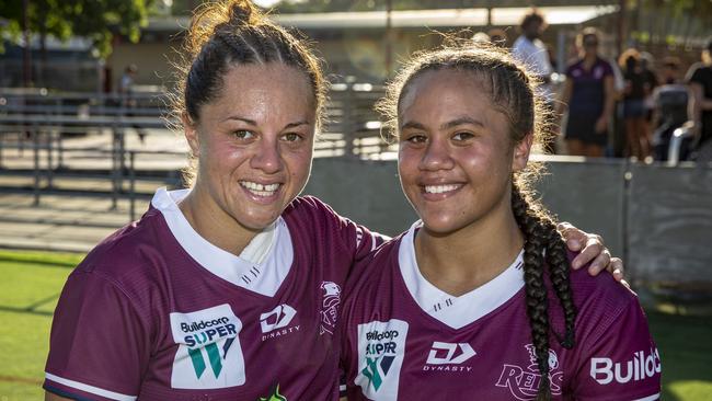 Queensland Reds halfback and schoolteacher Cobie-Jane Morgan (left) welcoming her Marsden State High student Destiny Brill to the team. Photo: Brendan Hertel, QRU