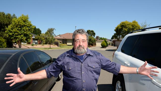 Mark Northover of Rowville lives in a court where if vehicles 'legally' park on both sides of the street it effectively blocks access. Picture: Steve Tanner.