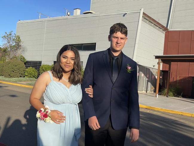 The students walked the red carpet at the formal.