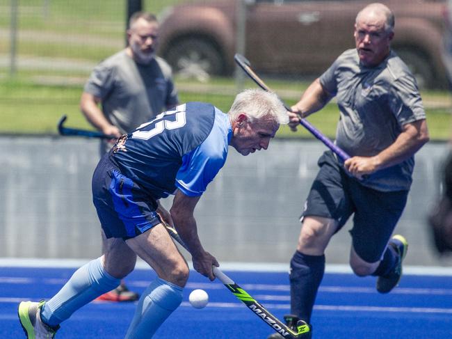 Action in the Pan Pacific Masters Games Hockey tournament. Picture: Glenn Campbell