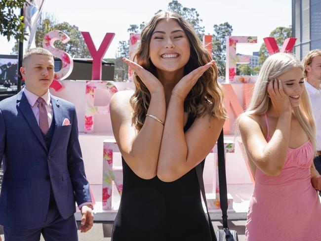 Race-goers pose for photos. Picture: Jenny Evans/Getty Images