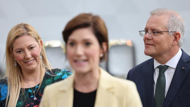 Prime Minister Scott Morrison and Boothby candidate Dr Rachel Swift look on as retiring Boothby MP Nicolle Flint speaks during a tour of Micro X at the Tonsley Innovation District in Adelaide on November 26, 2021. Picture: NCA NewsWire / David Mariuz