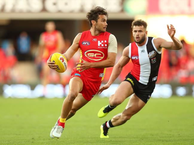 Jarrod Harbrow of the Suns runs the ball during the round 13 AFL match between the Gold Coast Suns and the St Kilda Saints at Metricon Stadium on June 16, 2018 in Gold Coast, Australia. (Photo by Chris Hyde/Getty Images)