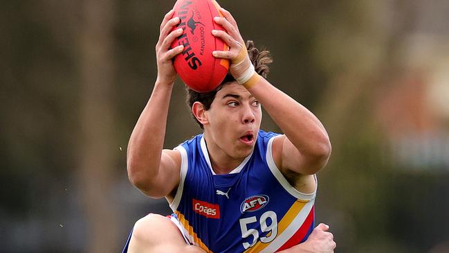 MELBOURNE, AUSTRALIA - SEPTEMBER 09: Cooper Trembath of the Eastern Ranges is tackled by Charlie Richardson of the Oakleigh Chargers  during the Coates Talent League Boys Quarter Final match between Eastern Ranges and Oakleigh Chargers at Highgate Reserve on September 09, 2023 in Melbourne, Australia. (Photo by Kelly Defina/AFL Photos/via Getty Images )