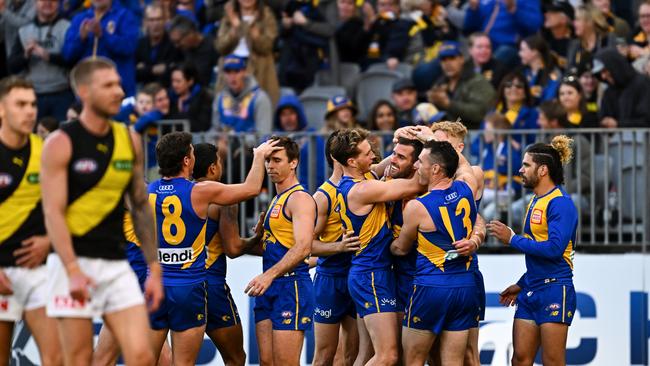 The Eagles get around Jack Darling for kicking goal number 500 of his career. Picture: Getty Images