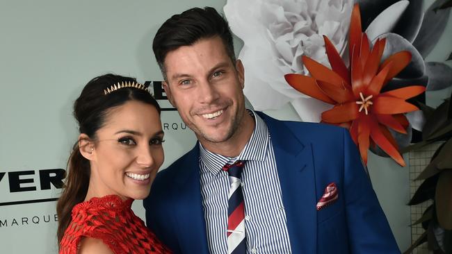 The Bachelor Sam Wood (right) and Snezana Markoski pose for photos in the Birdcage on Melbourne Cup Day at Flemington Racecourse in Melbourne, Tuesday, Nov. 3, 2015. (AAP Image/Julian Smith) NO ARCHIVING, EDITORIAL USE ONLY