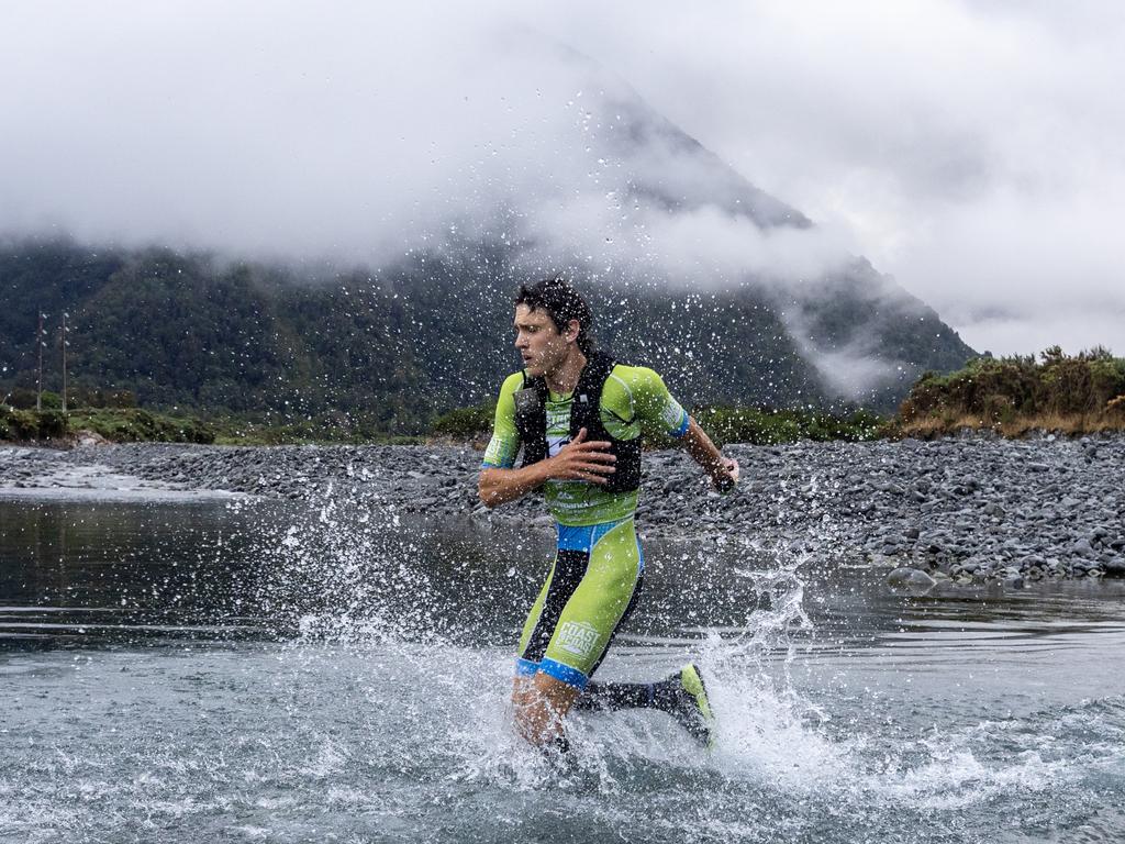 Tasmanian Alex Hunt at the first river crossing of the mountain run in the gruelling 243km Kathmandu Coast to Coast in New Zealand. Picture: Iain McGregor/Coast to Coast