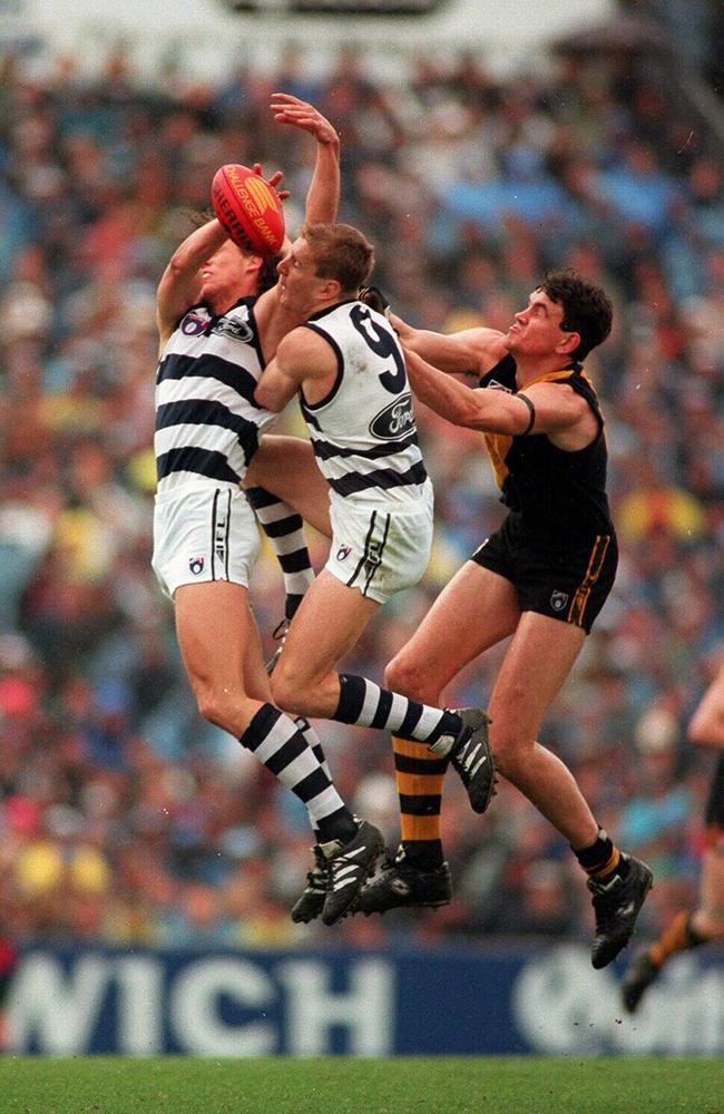Tudor leaps for mark during his playing days with Geelong.
