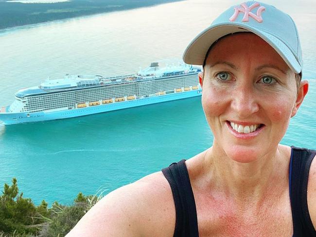 Ange Wallace posted a selfie with the Ovation of the Seas in the background.