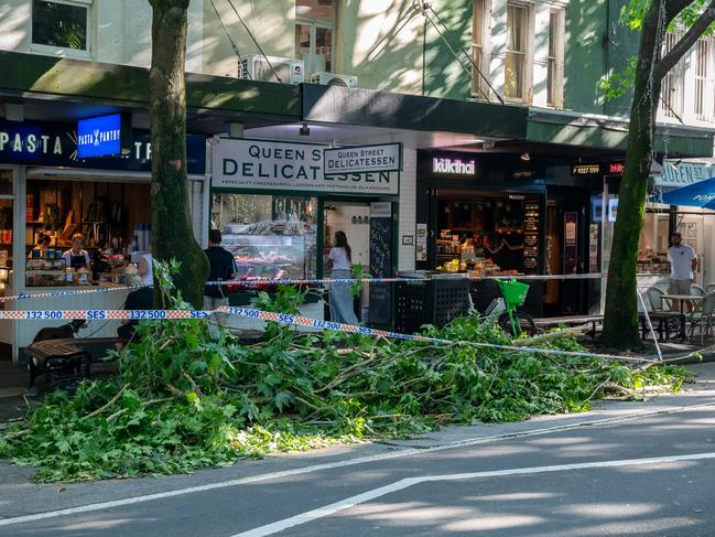 Storm mop up in Woollahra on Monday morning. Picture: Thomas Lisson