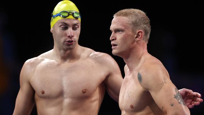 Cody Simpson gets a pat on the back from Matthew Temple after his swim in the heat . Picture: Michael Klein