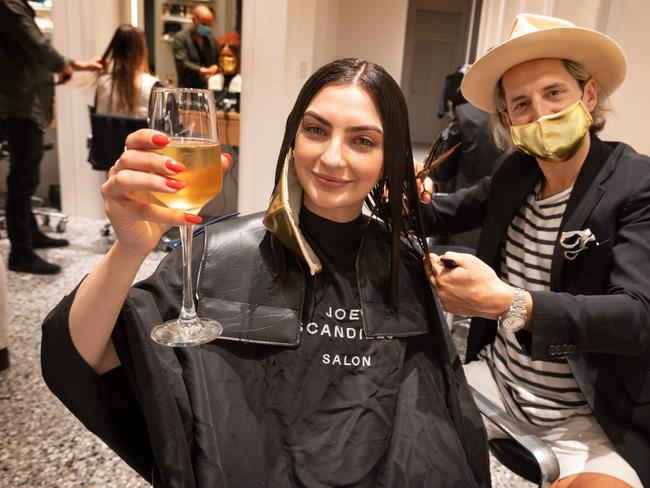 Joey Scandizzo Salon does a midnight haircut on Sarah-Jane Gravin at his South Yarra salon. Picture: Tony Gough