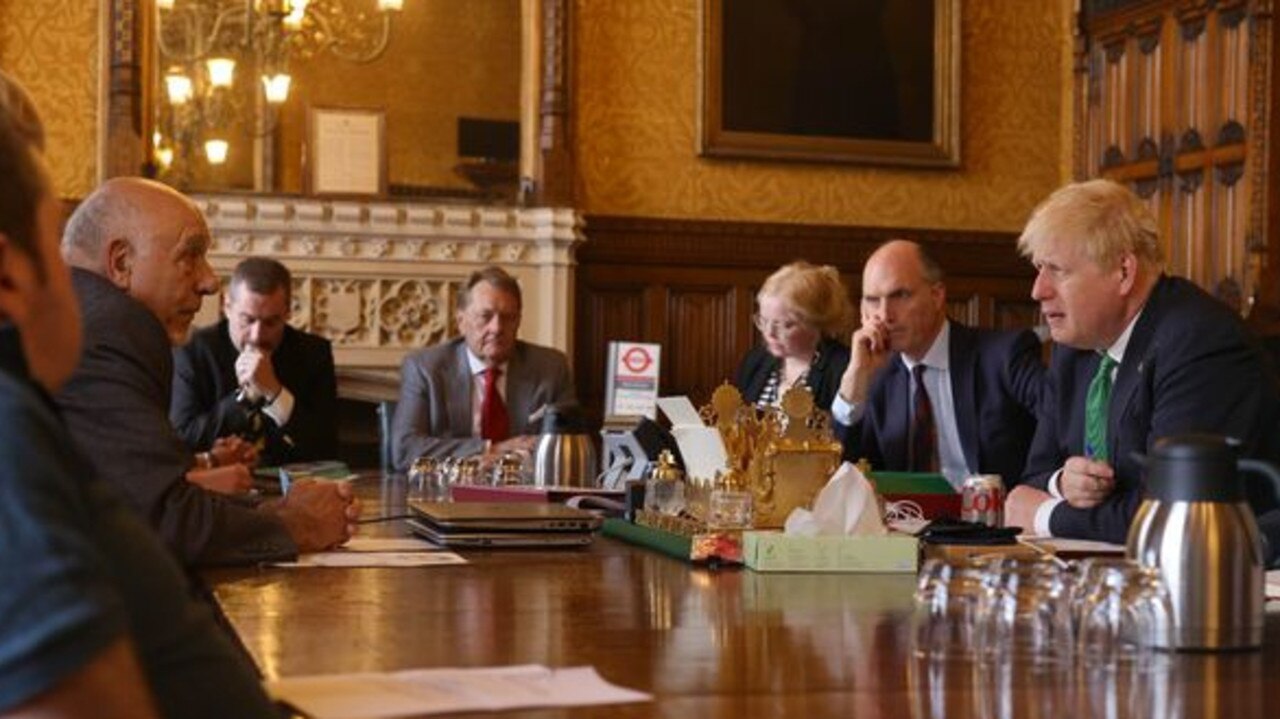 The Prime Minister listens as test veteran John Morris demands justice. Picture by Andrew Parsons / No 10 Downing Street