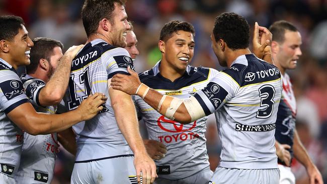 Te Maire Martin of the Cowboys celebrates a try.