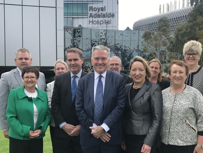 A beaming Health Minister Stephen Wade at the RAH flanked by nine of the 10 Local Health Network chief executives responding to the ICAC report into SA Health. Dr McGowan was absent as he was being interviewed by an independent investigator. Picture: Brad Crouch