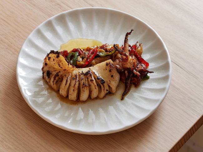 Whole grilled squid, red capsicum at Cottage Kitchen restaurant, North Adelaide . Picture: Supplied