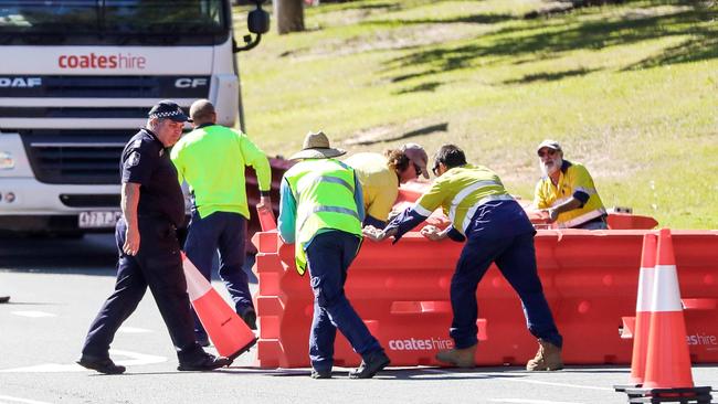 Workers putting the new border wall in place in Coolangatta yesterday. Picture: Nigel Hallett.