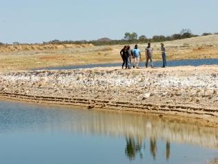 Infastructure Minister Delia Lawrie opens the dam at Yuelamu.