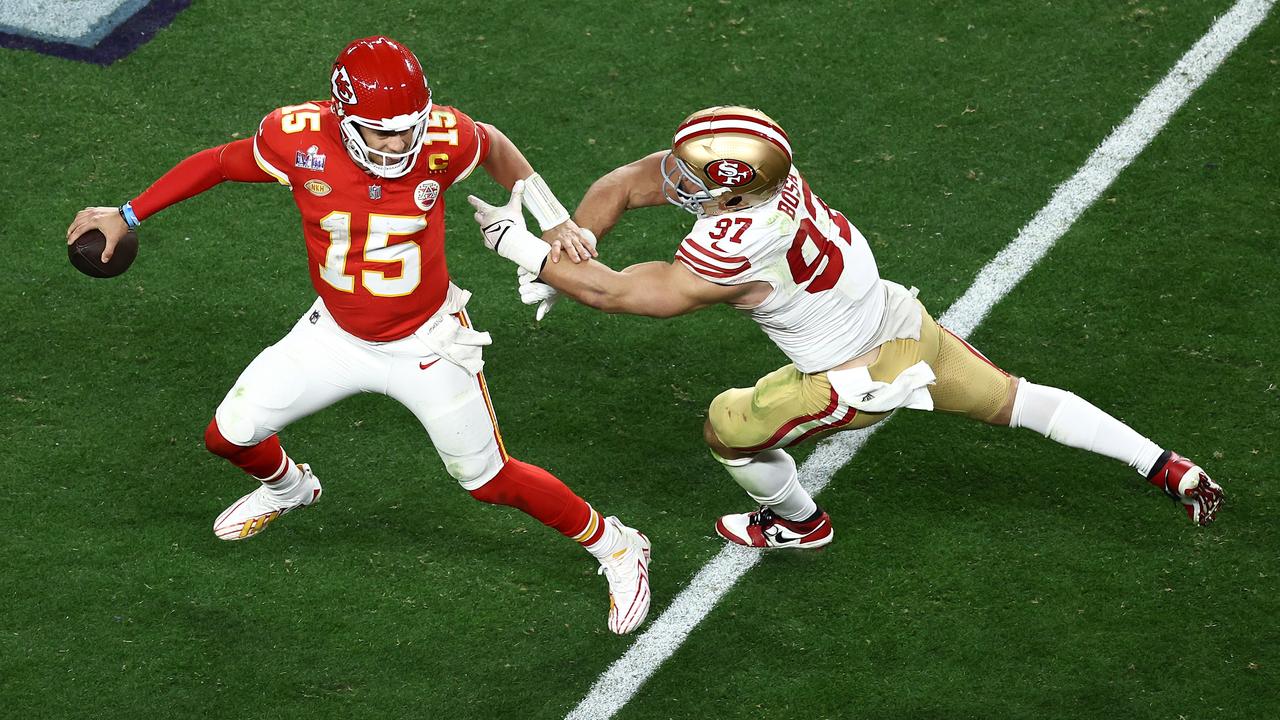 LAS VEGAS, NEVADA - FEBRUARY 11: Patrick Mahomes #15 of the Kansas City Chiefs is pressured by Nick Bosa #97 of the San Francisco 49ers in the fourth quarter during Super Bowl LVIII at Allegiant Stadium on February 11, 2024 in Las Vegas, Nevada. (Photo by Tim Nwachukwu/Getty Images)