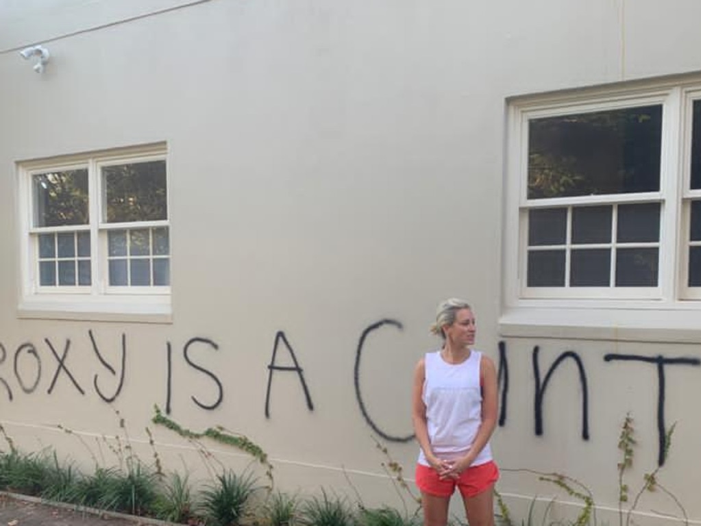 Roxy Jacenko in front of the graffiti attack on her offices. Picture: Supplied.