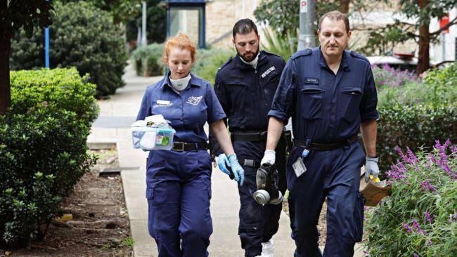 Forensic police enter the Riverwood apartment block where a three-year-old boy was found dead. Picture: Adam Yip