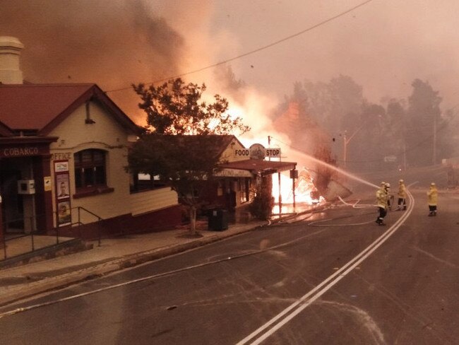 Seven buildings have been burnt down and two people are missing after a fire tore through the centre of Cobargo on Tuesday morning. Picture: Neil Crawley