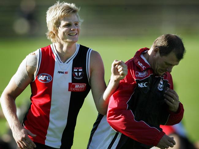 A young Nick Riewoldt mucks around with Grant Thomas.