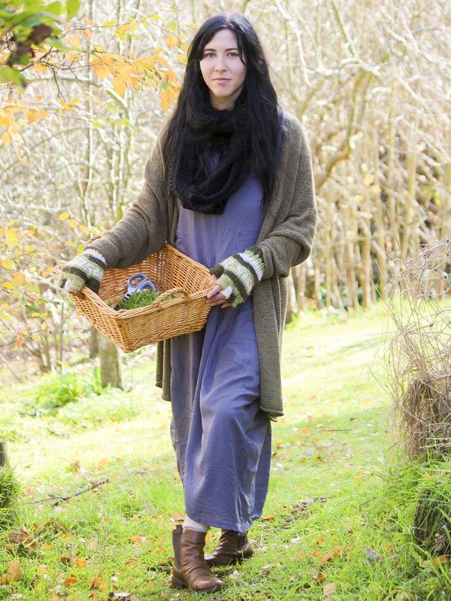 Self-taught herbalist Shy Scott collects plants from her Ranelagh garden. Picture: TRACY RENKIN