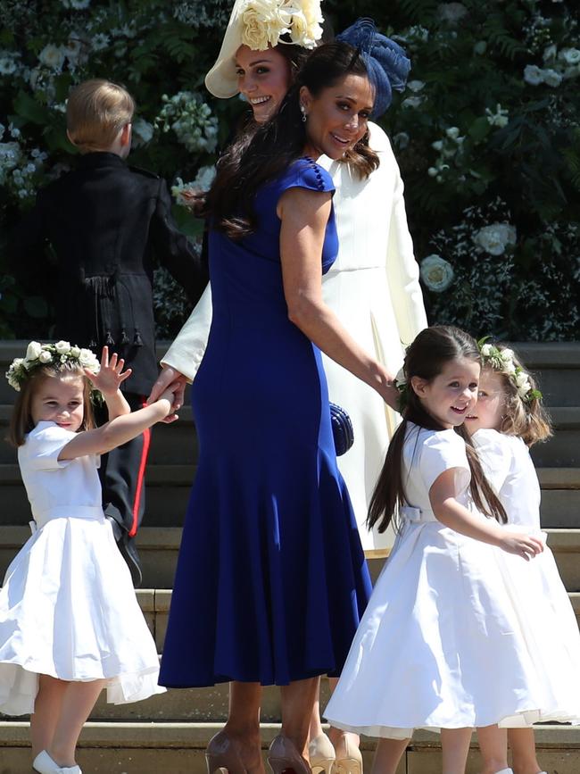 Canadian fashion stylist Jessica Mulroney holds bridesmaids hands. Picture: AFP