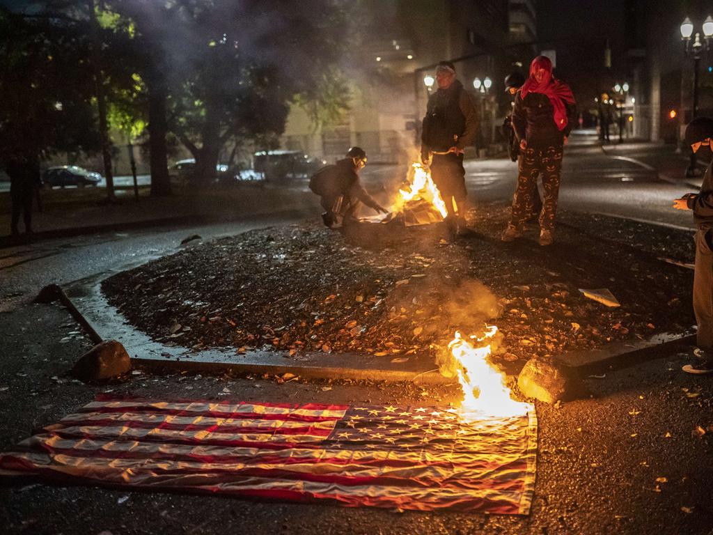 A flag is burned in Portland, Oregon. Picture: Nathan Howard/Getty Images/AFP